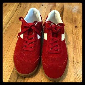 Red and White Diadora red suede sneakers.